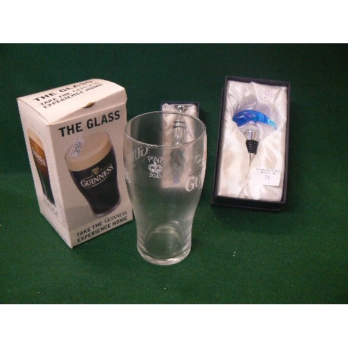 73 - TWO DECORATIVE GLASS BOTTLE STOPPERS AND A GUINNESS GLASS ALL IN ORIGINAL BOXES.