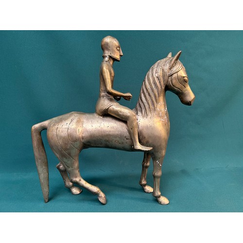 218 - Most unusual large vintage metal horse with Trojan warrior in full helmet. 43cm long X 44cm H