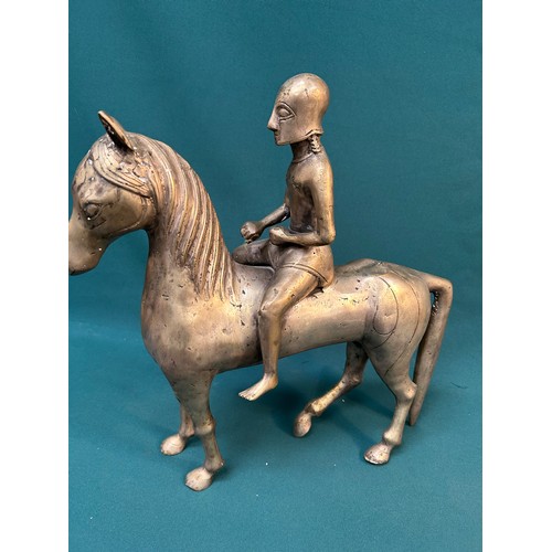 218 - Most unusual large vintage metal horse with Trojan warrior in full helmet. 43cm long X 44cm H