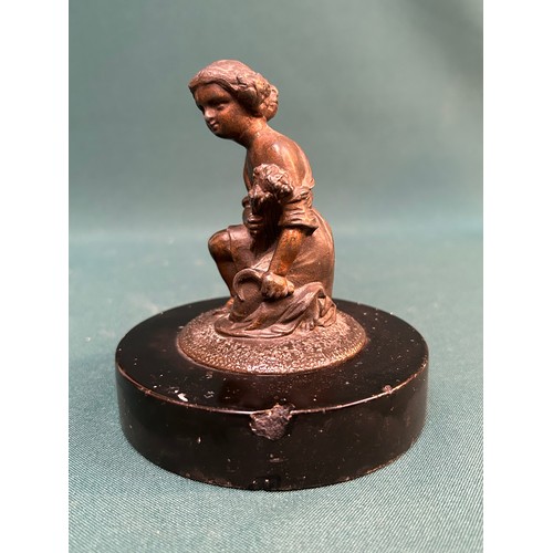 16 - A 19th Century spelter figure of a girl holding wheat and a scythe emblematic of autumn. On a black ... 