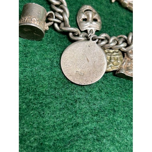 5 - VINTAGE SILVER CHARM BRACELET WITH 18 CHARMS INCLUDING SOLDIER, BUDDHA, MONKEY ETC. CHAIN WITH STERL... 