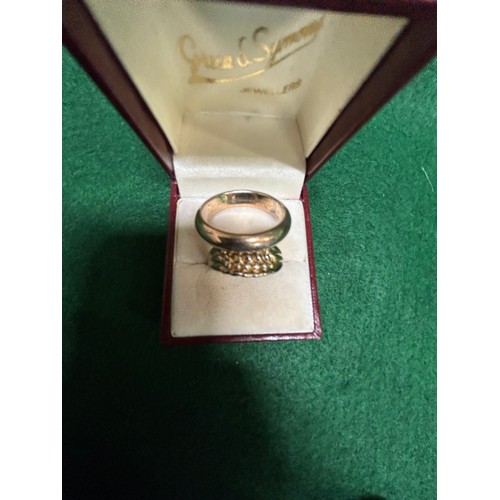 7 - TWO 9CT GOLD AND SILVER RINGS, ONE MARKED 