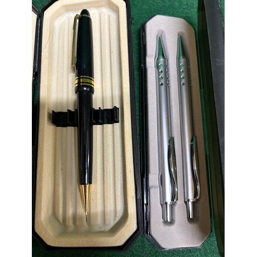 12 - PAIR OF BRUSHED STEEL BALLPOINT PENS IN A CASE AND A BLACK AND GILT PENCIL IN CASE.