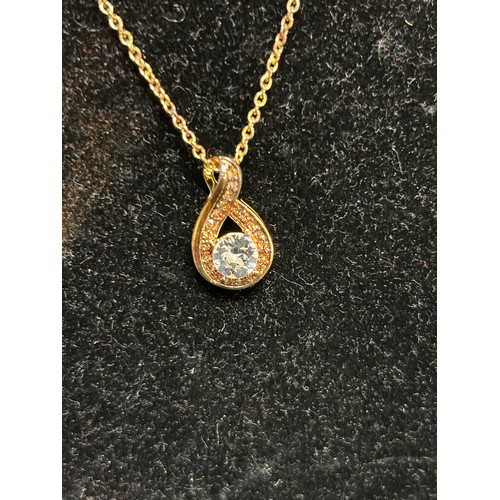 6 - GILT METAL PENDANT WITH A STAR DESIGN & CLEAR STONE ON A GILT CHAIN AND A FURTHER INFINITY SWIRL PEN... 