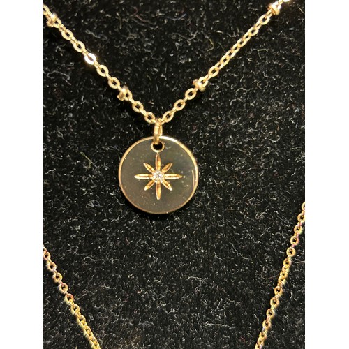 6 - GILT METAL PENDANT WITH A STAR DESIGN & CLEAR STONE ON A GILT CHAIN AND A FURTHER INFINITY SWIRL PEN... 