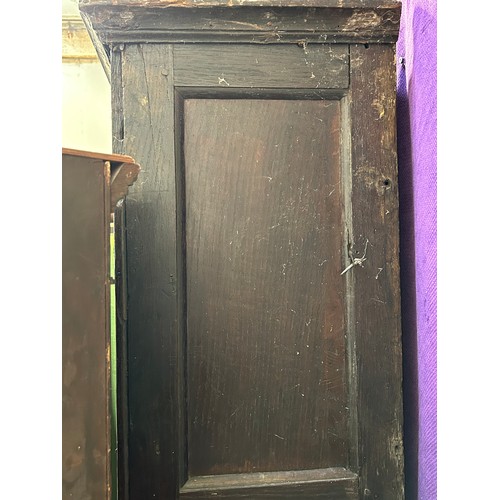 351 - A very large antique oak Housekeepers cupboard from a Norfolk country house. The doors each with fou... 