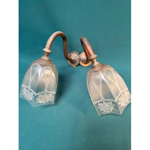 318D - A pair of Victorian brass armed gas wall lights with Art Nouveau style frosted & etched glass shades