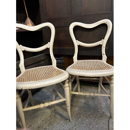 377 - Pair of Victorian balloon back chairs with canework seats, painted in a stone colour