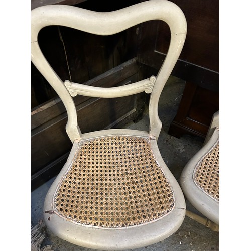 377 - Pair of Victorian balloon back chairs with canework seats, painted in a stone colour