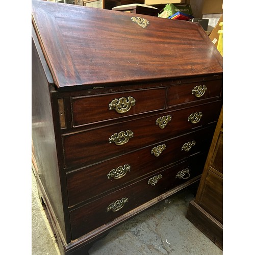 394 - A Georgian mahogany bureau two over three drawers from a Norfolk country house. The fall front enclo... 