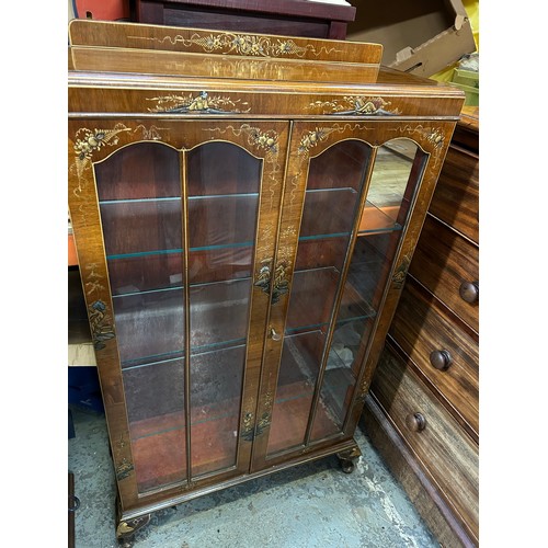 347 - A good 1920's walnut display cabinet in oriental style with raised gilt design of figures and landsc... 