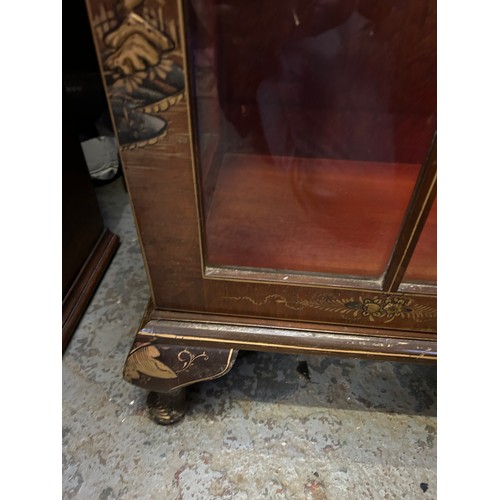 347 - A good 1920's walnut display cabinet in oriental style with raised gilt design of figures and landsc... 