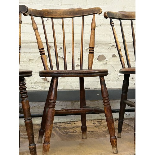 346 - Four early 20th Century stick back penny seat chairs with turned legs and stretchers