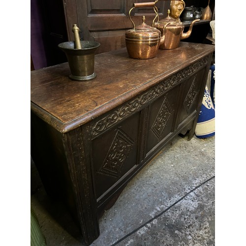 350 - Large late 17th or early 18th Century 6 plank coffer. The front with three carved panels below a car... 