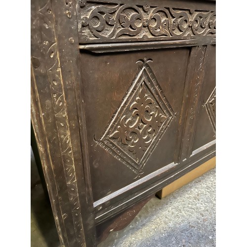 350 - Large late 17th or early 18th Century 6 plank coffer. The front with three carved panels below a car... 