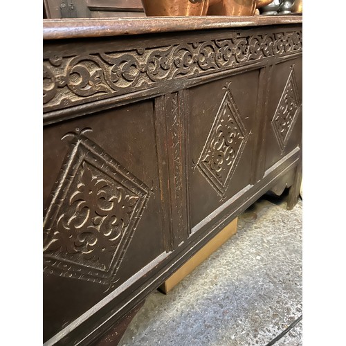 350 - Large late 17th or early 18th Century 6 plank coffer. The front with three carved panels below a car... 