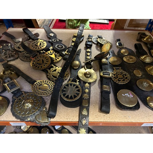 369 - Good selection of antique horse brasses, mostly on straps to include 10 single & double face pieces,... 