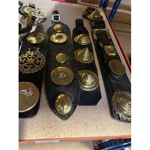 369 - Good selection of antique horse brasses, mostly on straps to include 10 single & double face pieces,... 