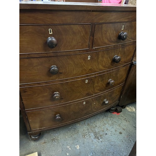 372 - Victorian mahogany bow fronted chest of drawers on turned feet and with original knobs. 105cm x52cm ... 