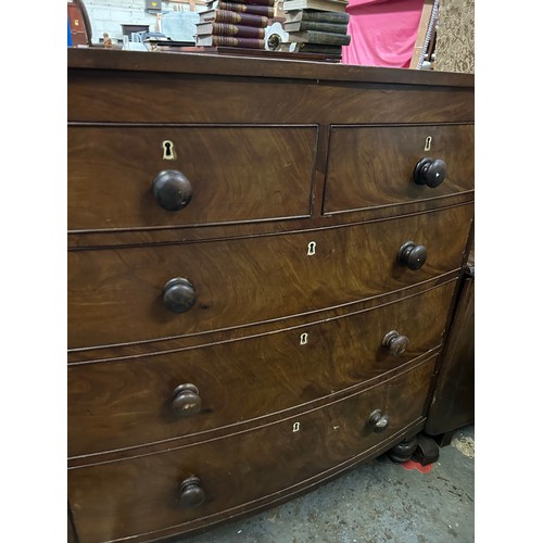 372 - Victorian mahogany bow fronted chest of drawers on turned feet and with original knobs. 105cm x52cm ... 