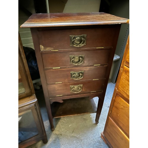 373 - An Edwardian sheet music cabinet, the drop down drawer fronts with Arts & Crafts style handles