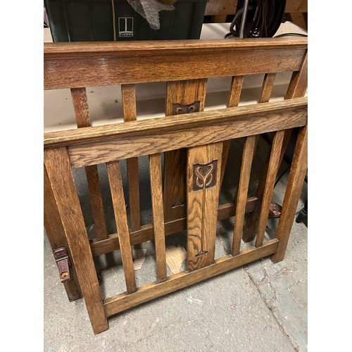 378 - Edwardian oak single bed ends, the central splat carved with an Art Nouveau design