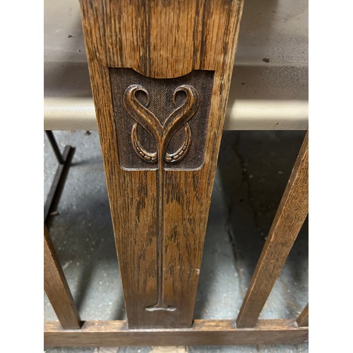 378 - Edwardian oak single bed ends, the central splat carved with an Art Nouveau design