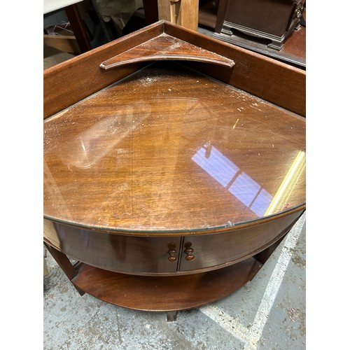 389 - Edwardian mahogany bow fronted corner washstand with glass top and upstand with small shelf