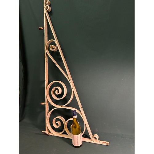 327C - A large Victorian wrought iron wall bracket for a pub or shop sign- with metal loops for hanging a w... 