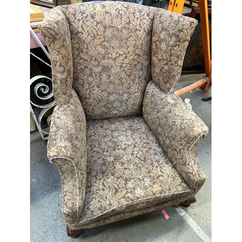 354 - Early 20th Century wing back armchair on short cabriole legs with original brass castors. Upholstere... 