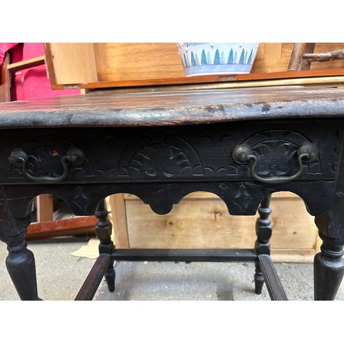 352 - Antique oak side  table with shaped top, turned legs, drawer with carved front and carved apron belo... 