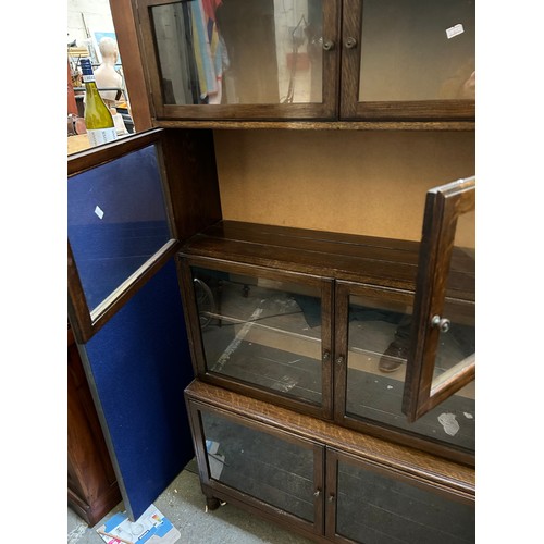 332 - A 1940's Globe Wernicke style oak bookcase. Unlike the Wernicke, the doors are side hinged and the b... 