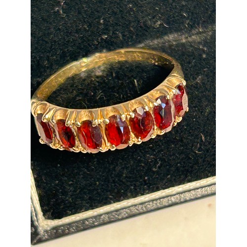 19C - A BEAUTIFUL HALF ETERNITY RING 9CT GOLD WITH 7 BLOOD RED GARNETS SIZE R 1/2 WEIGHT 2.83GR