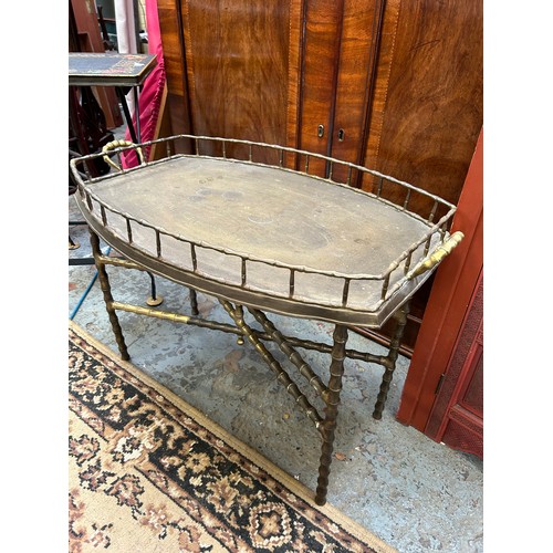 412 - A large mid century Chinese pierced brass tray table (Benares type) dia 80cm with wooden folding sta... 