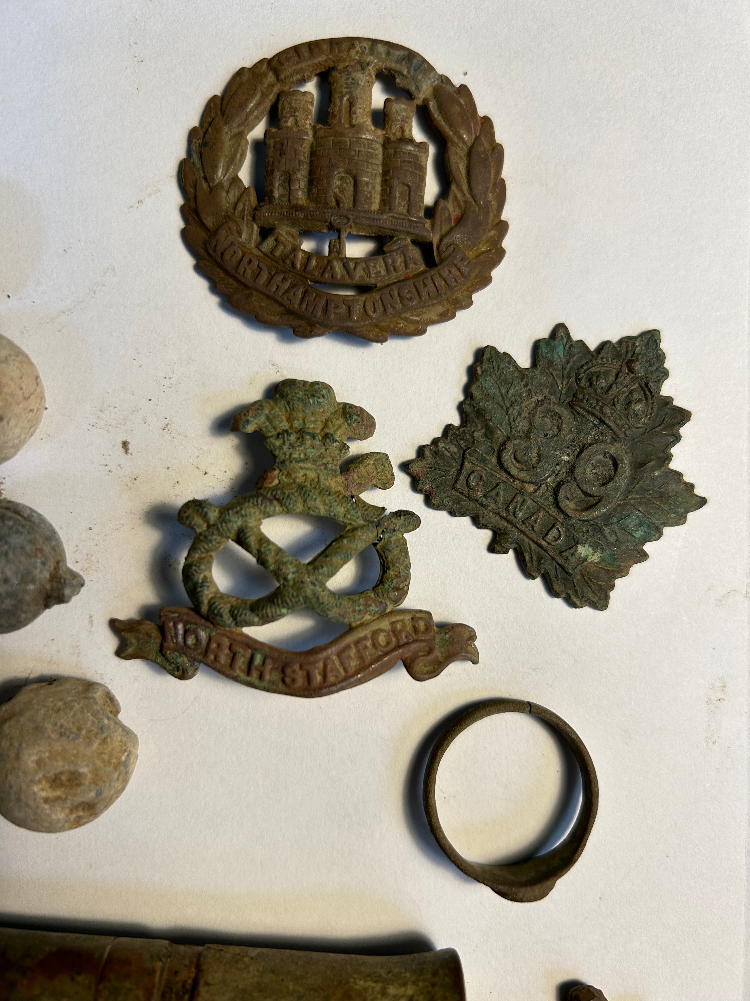 Metal detecting finds including lead musket balls, toy soldier, turtle ...