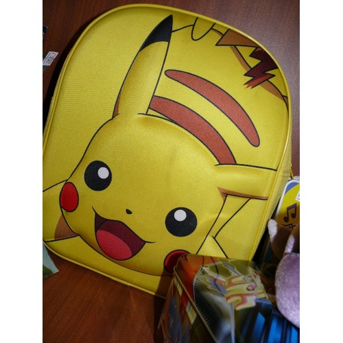 130 - POKEMON NEOPRENE BACKPACK, GENESECT PLUSH TOY, CARD GAME TIN CONTAINING FIGURES AND SOME CARD GAMES.