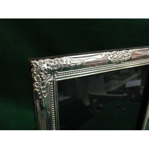 74 - A LARGE SILVER PLATE ORNATE PICTURE FRAME