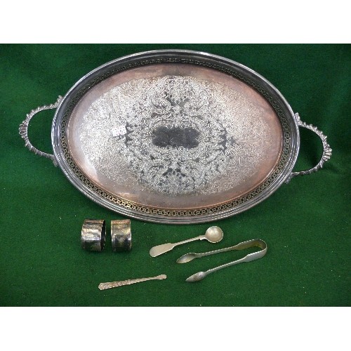 85 - A DECORATIVE SILVERPLATE TRAY WITH CONTENTS OF SPOONS, TONGS AND NAPKIN RINGS