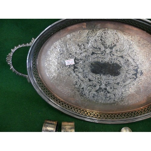 85 - A DECORATIVE SILVERPLATE TRAY WITH CONTENTS OF SPOONS, TONGS AND NAPKIN RINGS