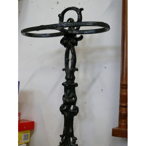 123 - A CAST IRON UMBRELLA STAND