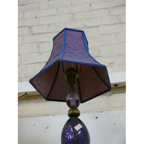 150 - A LOVELY PURPLE GLASS LAMP WITH METAL LEGS