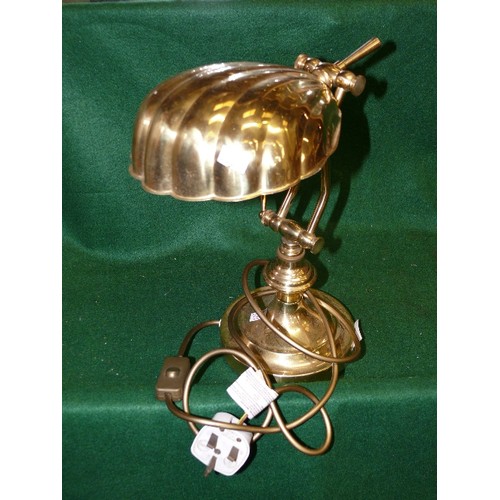 151 - A BRASS DESK LAMP WITH A METAL SHELL SHAPED SHADE