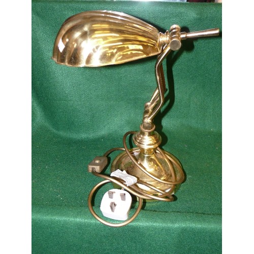 151 - A BRASS DESK LAMP WITH A METAL SHELL SHAPED SHADE