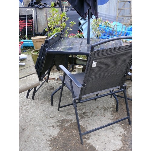 389 - SQUARE GLASS GARDEN TABLE WITH FOUR MATCHING CHAIRS AND PARASOL