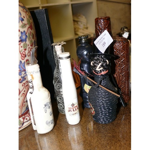 A SELECTION OF VARIOUS DECORATIVE BOTTLES AND DECANTERS