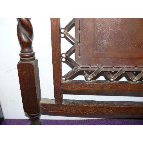 115 - A DECORATIVE WOOD AND LEATHER FIRE SCREEN