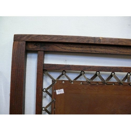 115 - A DECORATIVE WOOD AND LEATHER FIRE SCREEN