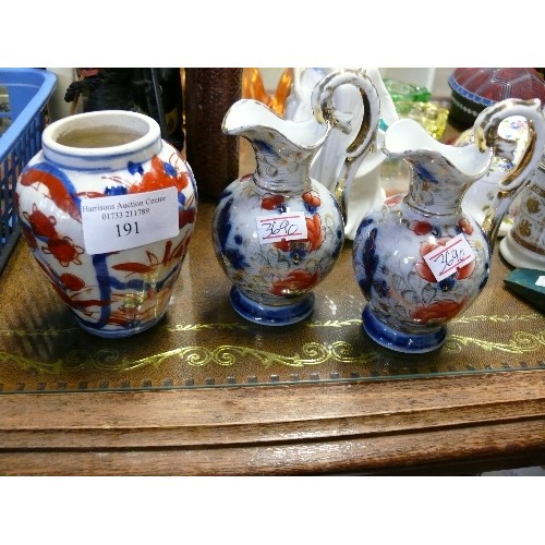 191 - A PAIR OF DECORATIVE ORIENTAL STYLE JUGS PLUS A MATCHING VASE.