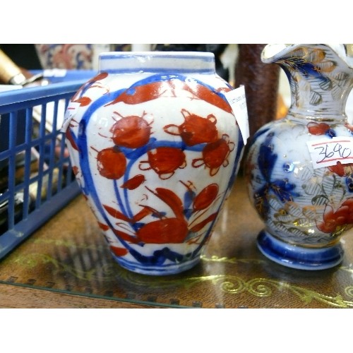 191 - A PAIR OF DECORATIVE ORIENTAL STYLE JUGS PLUS A MATCHING VASE.