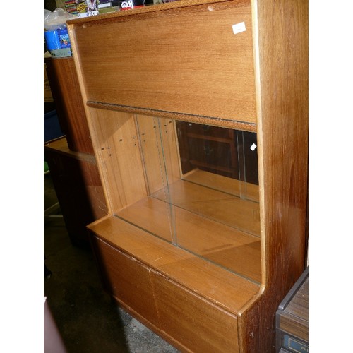 503 - TURNIDGE OF LONDON WALL CABINET WITH SLIDING DOORS AND DROP DOWN DRINKS SECTION.